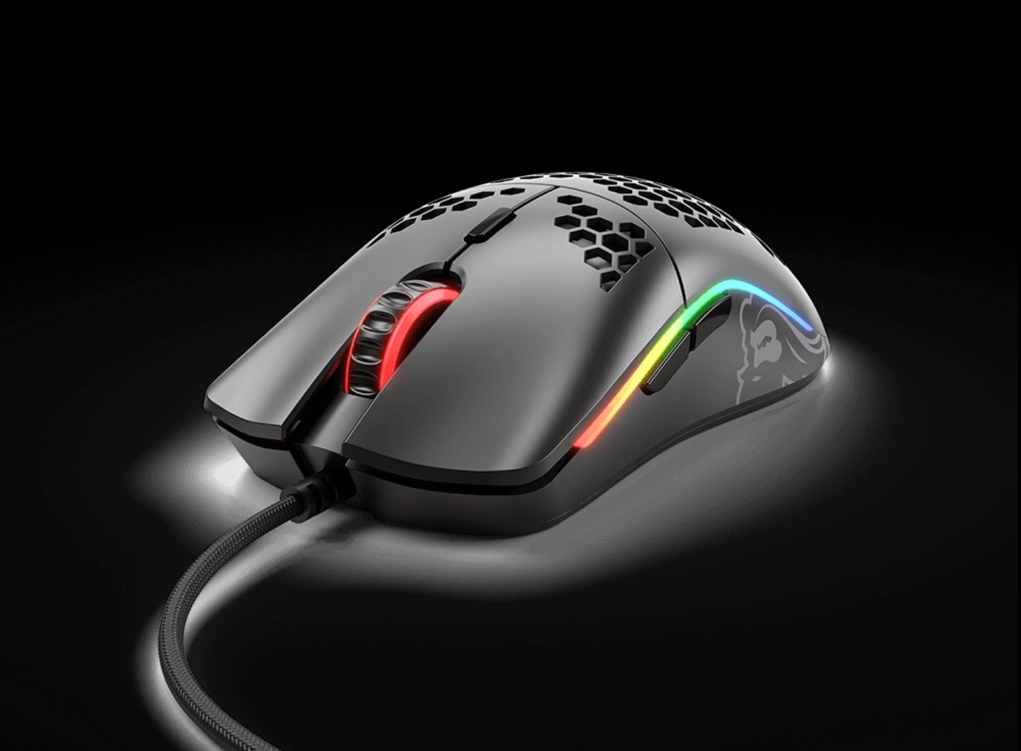 Glorious Model O RGB gaming mouse showing its lightweight honeycomb shell design with RGB lighting